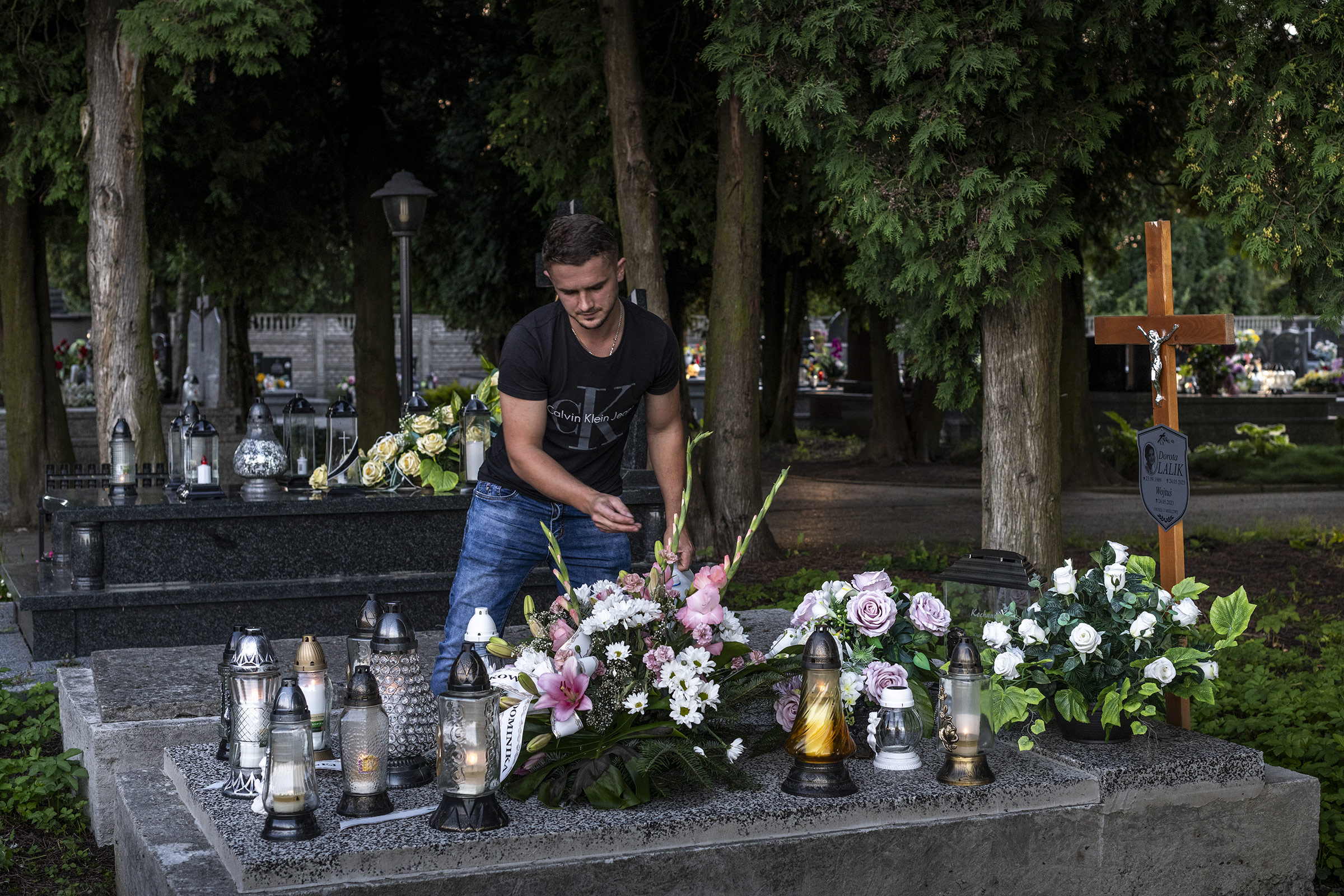 Marcin Lalik visits the grave of his wife Dorota and their son every day after work.