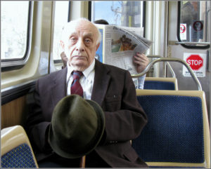 Elderly man  riding the bus 