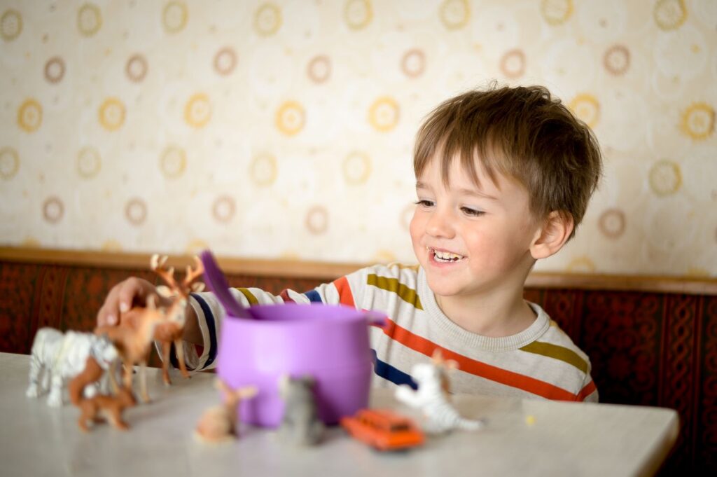 Small child playing with their toys